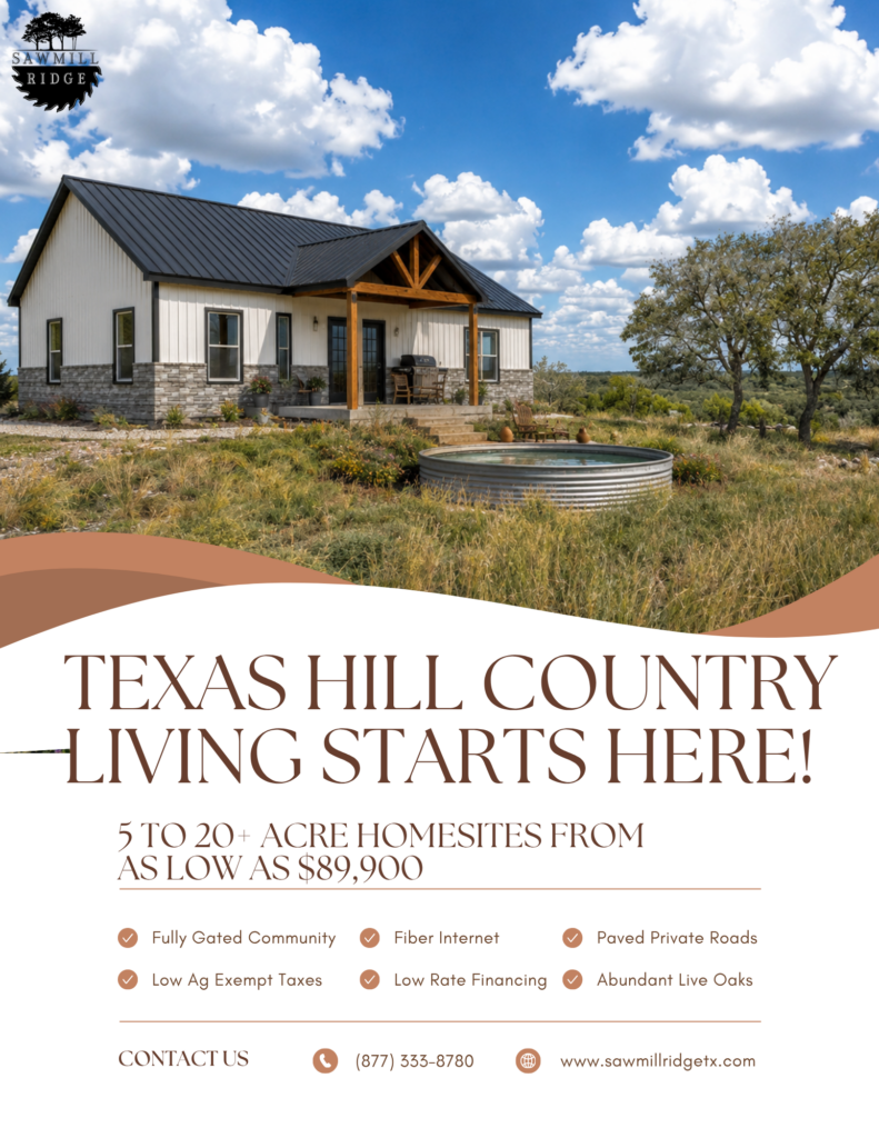 Modern white house with stone veneer, wooden porch, and a round metal water tank in a Texas Hill Country landscape.